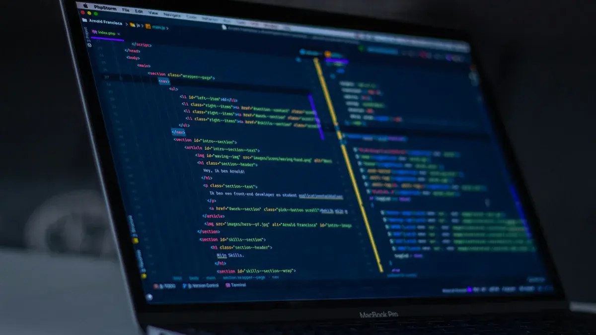 Software engineer workstation displaying production code and container telemetry